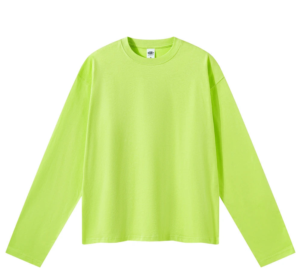 A bright neon yellow-green long-sleeve crewneck t-shirt laid flat against a solid white background.