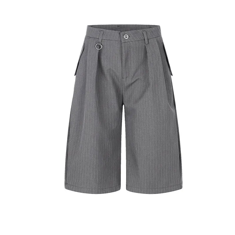 A pair of gray pinstriped shorts with a unique wide-leg silhouette, featuring pleats at the front, side pockets, and a metal ring detail on the waistband, shown against a plain white background.